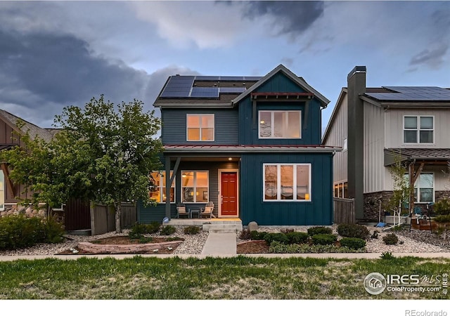 1356 Golden Eagle Way, Louisville, CO 80027 - craftsman-style house with board and batten siding, solar panels, and a porch