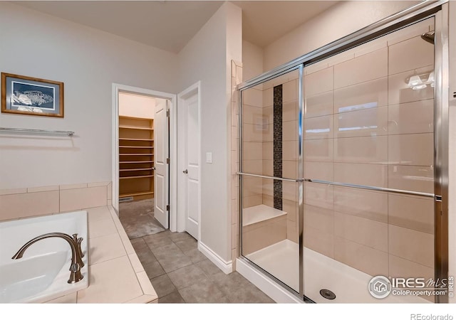 1356 Golden Eagle Way, Louisville, CO 80027 - full bath with a bath, tile patterned flooring, a shower stall, and a walk in closet