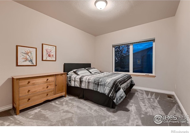 1356 Golden Eagle Way, Louisville, CO 80027 - bedroom featuring a textured ceiling, baseboards, and light colored carpet