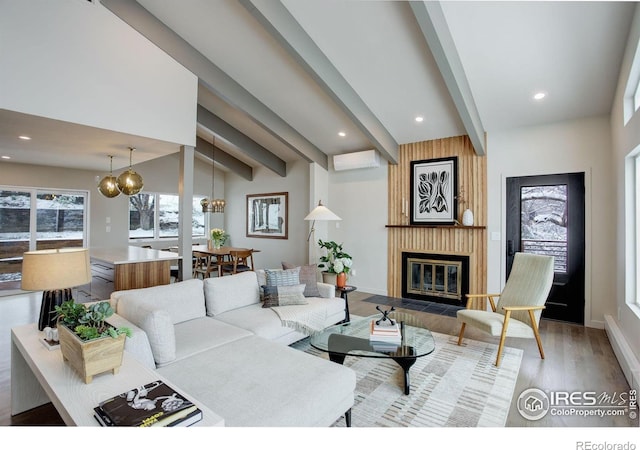 1048 Westview Dr, Boulder, CO 80303 - living area with an inviting chandelier, recessed lighting, wood finished floors, and a large fireplace