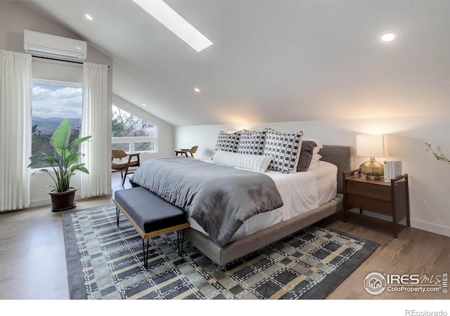 1048 Westview Dr, Boulder, CO 80303 - bedroom with baseboards, a wall mounted AC, lofted ceiling with skylight, and wood finished floors