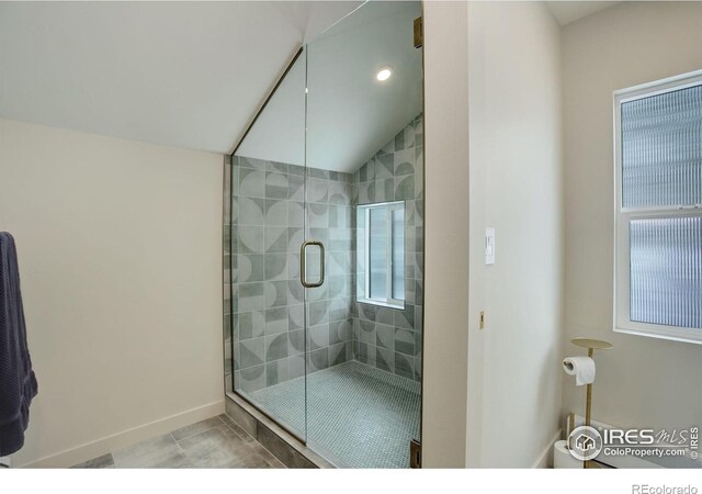 1048 Westview Dr, Boulder, CO 80303 - bathroom with tile patterned flooring, lofted ceiling, baseboards, recessed lighting, and a stall shower