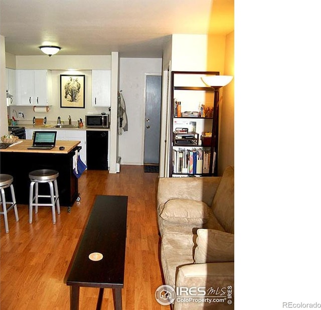 living area with light wood-style floors