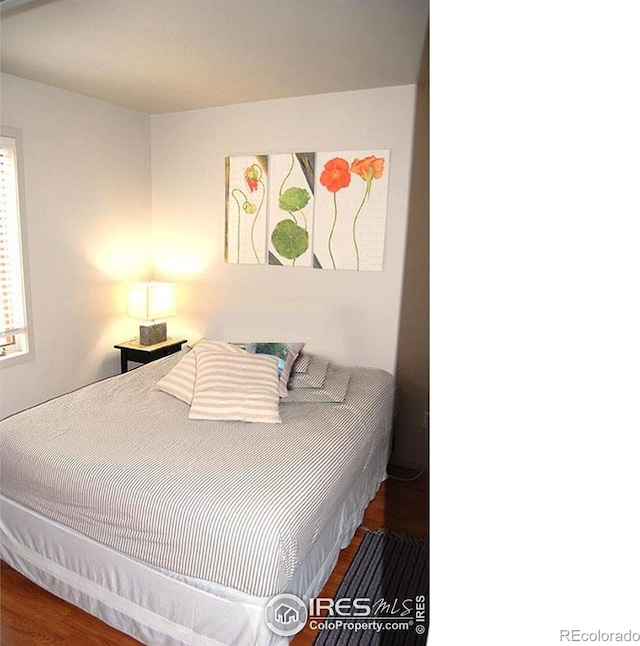 bedroom featuring wood finished floors