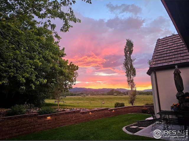 895 Owl Grove Pl, Loveland, CO 80537 - yard at dusk featuring a mountain view
