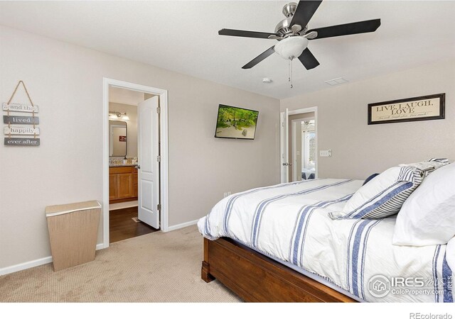 4737 Sandy Ridge Ave, Firestone, CO 80504 - bedroom featuring ensuite bath, baseboards, light colored carpet, and a ceiling fan