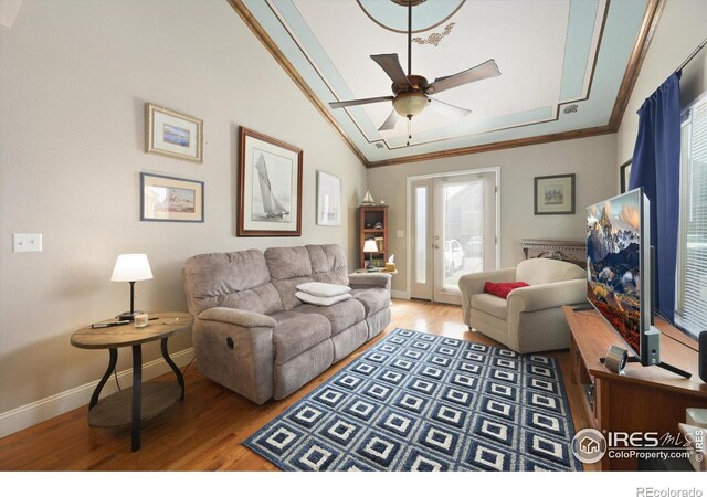 1020 Rolland Moore Dr Unit 2D, Fort Collins, CO 80526 - living room featuring vaulted ceiling, baseboards, light wood-style floors, ceiling fan, and crown molding