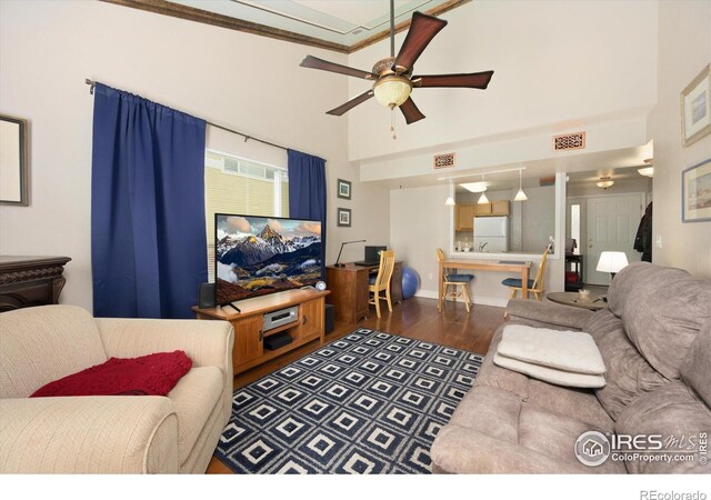 1020 Rolland Moore Dr Unit 2D, Fort Collins, CO 80526 - living room featuring wood finished floors, a ceiling fan, and visible vents