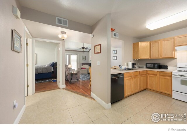1020 Rolland Moore Dr Unit 2D, Fort Collins, CO 80526 - kitchen featuring visible vents, ceiling fan, light brown cabinets, light countertops, and black appliances