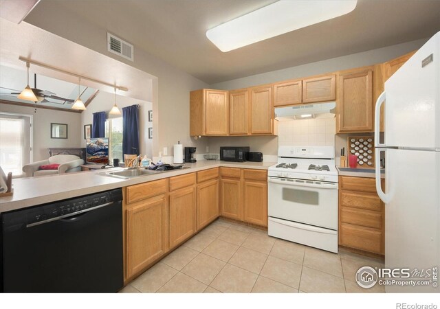 1020 Rolland Moore Dr Unit 2D, Fort Collins, CO 80526 - kitchen with a sink, black appliances, open floor plan, under cabinet range hood, and visible vents
