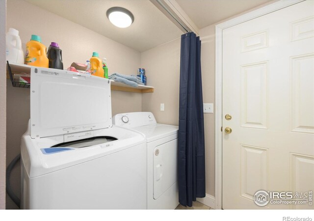 1020 Rolland Moore Dr Unit 2D, Fort Collins, CO 80526 - washroom with washing machine and dryer and laundry area