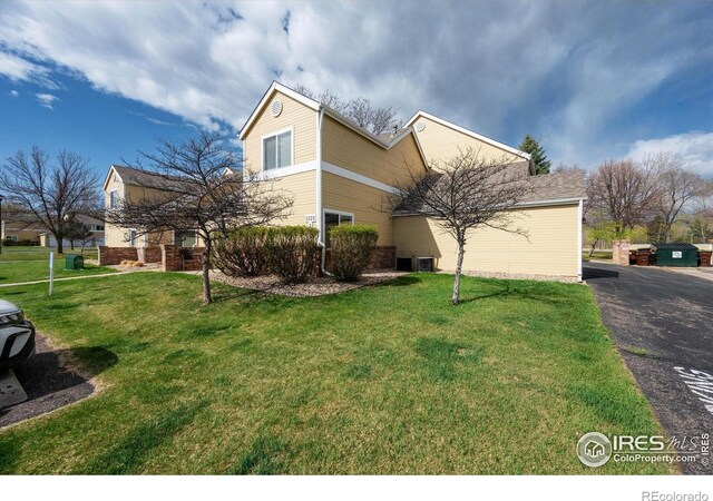 1020 Rolland Moore Dr Unit 2D, Fort Collins, CO 80526 - view of front of property featuring brick siding and a front yard