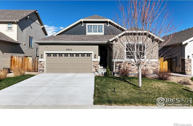 2842 Tallgrass Ln, Berthoud, CO 80513 - craftsman house with concrete driveway, fence, stone siding, and a front yard