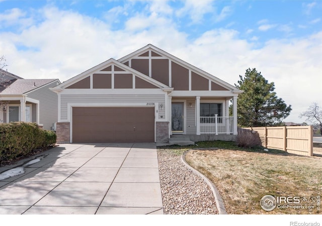 20336 Willowbend Ln, Parker, CO 80138 - view of front of property featuring concrete driveway, a porch, a garage, and brick siding