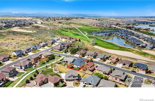 bird's eye view with golf course view, a residential view, and a water view