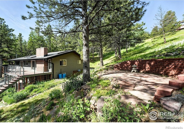 74 Sky Trail Rd, Boulder, CO 80302 - view of yard with stairway and a deck