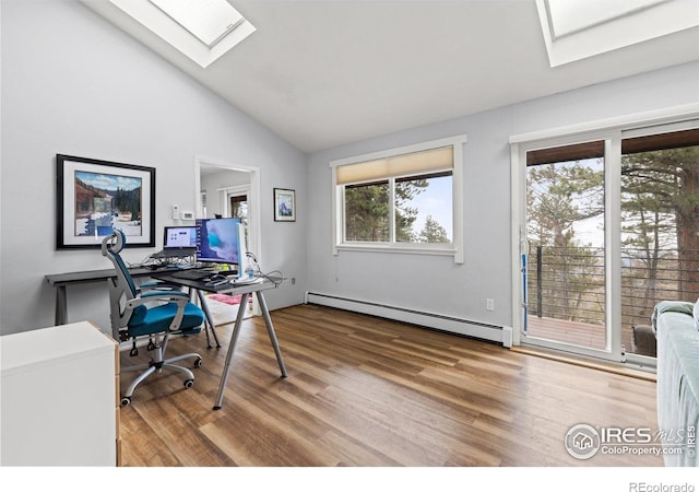 74 Sky Trail Rd, Boulder, CO 80302 - office featuring a baseboard heating unit, a skylight, vaulted ceiling, and wood finished floors