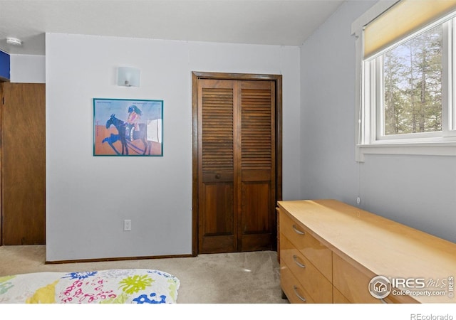 74 Sky Trail Rd, Boulder, CO 80302 - bedroom with light colored carpet and a closet