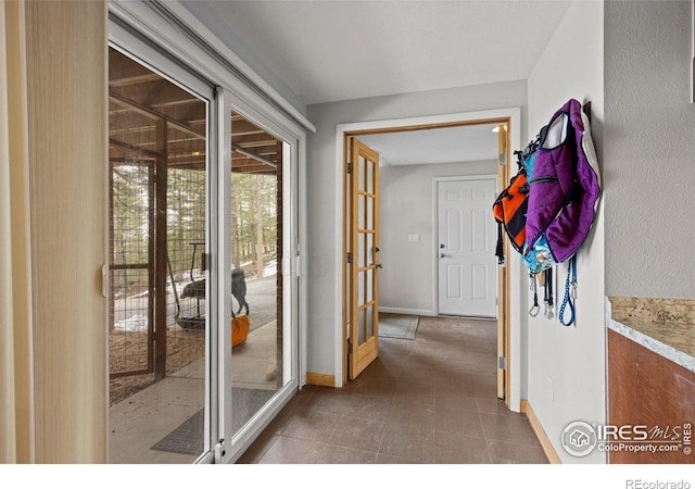 74 Sky Trail Rd, Boulder, CO 80302 - hallway with baseboards and dark tile patterned floors