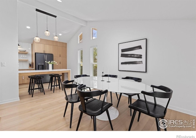 586 Aztec Dr, Boulder, CO 80303 - dining area with light wood-type flooring, baseboards, recessed lighting, beamed ceiling, and high vaulted ceiling
