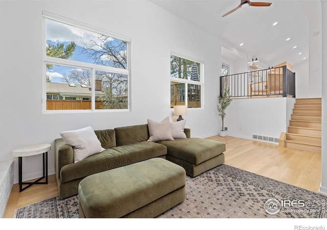 586 Aztec Dr, Boulder, CO 80303 - living room with recessed lighting, wood finished floors, visible vents, a ceiling fan, and stairs
