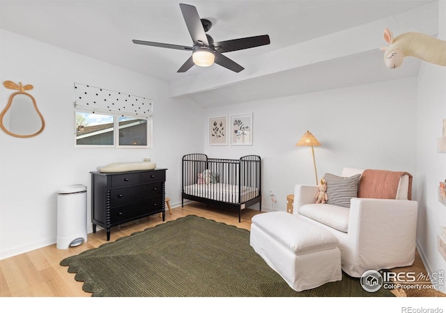 586 Aztec Dr, Boulder, CO 80303 - bedroom featuring a nursery area, wood finished floors, and ceiling fan