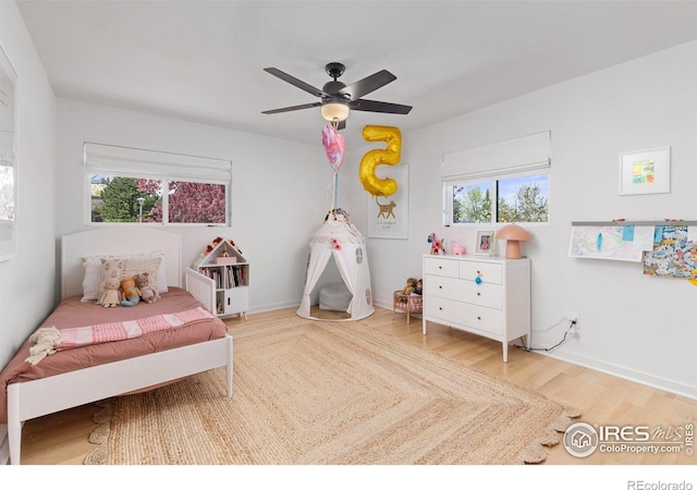 586 Aztec Dr, Boulder, CO 80303 - bedroom featuring baseboards, wood finished floors, and ceiling fan