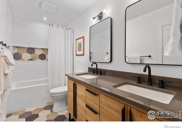 586 Aztec Dr, Boulder, CO 80303 - bathroom with shower / tub combo with curtain, a sink, double vanity, and toilet