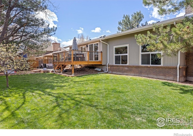 586 Aztec Dr, Boulder, CO 80303 - back of house with a wooden deck, brick siding, and a yard