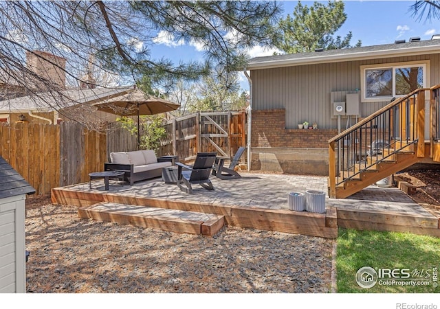 586 Aztec Dr, Boulder, CO 80303 - wooden terrace with a fenced backyard, outdoor lounge area, and a patio