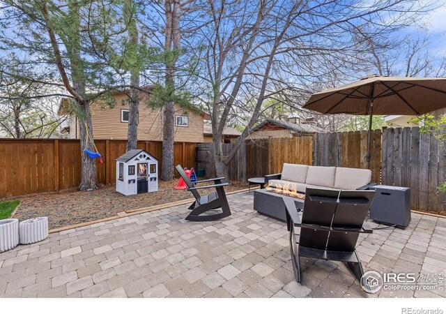 586 Aztec Dr, Boulder, CO 80303 - view of patio featuring a fenced backyard and an outdoor fire pit