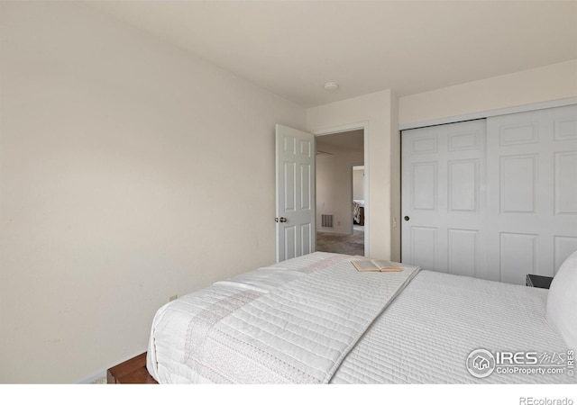 bedroom featuring a closet and visible vents