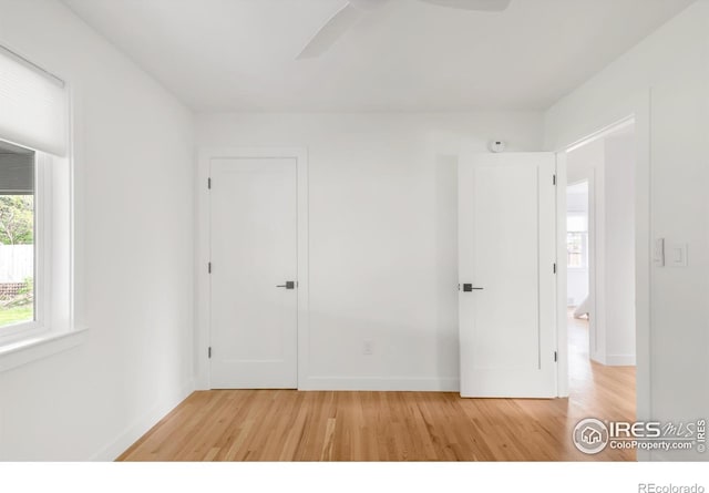 220 28th St, Boulder, CO 80305 - unfurnished bedroom with light wood-type flooring, a ceiling fan, baseboards, and a closet