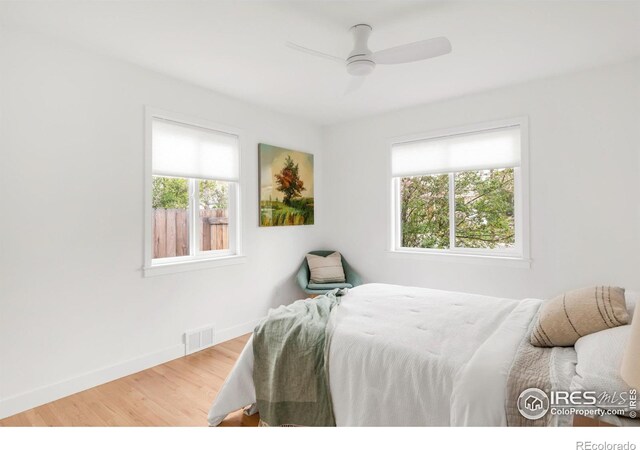 220 28th St, Boulder, CO 80305 - bedroom with a ceiling fan, baseboards, visible vents, and wood finished floors