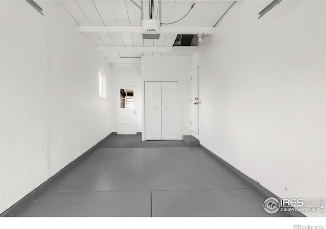 220 28th St, Boulder, CO 80305 - garage featuring baseboards and a garage door opener