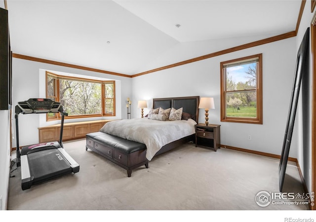 bedroom featuring crown molding, multiple windows, light carpet, and lofted ceiling