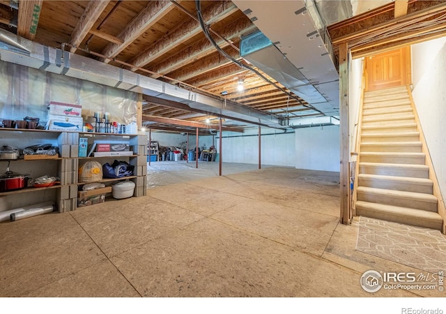 unfinished below grade area featuring stairs