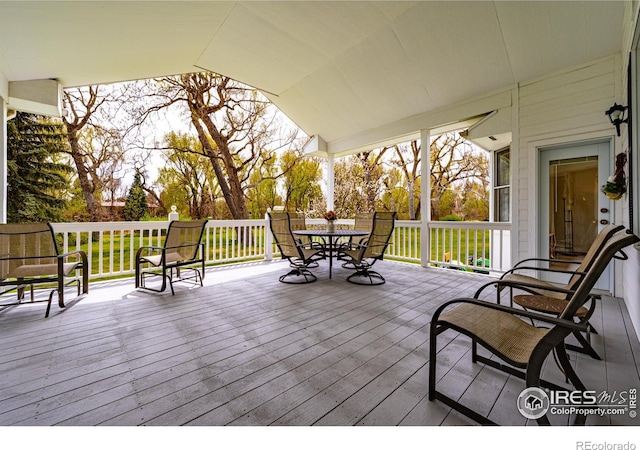 wooden deck featuring outdoor dining space