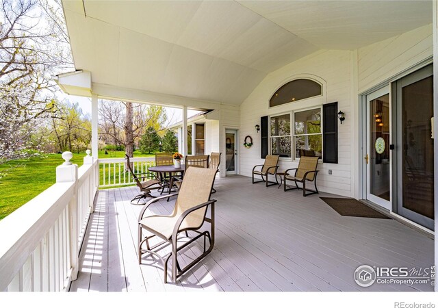 wooden deck featuring outdoor dining space