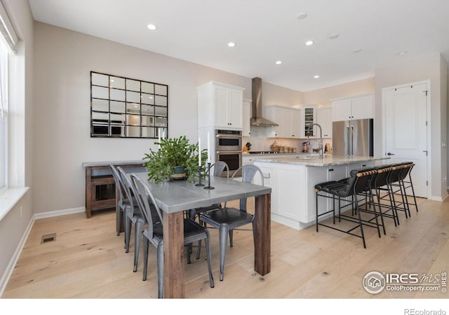 3351 Heron Lakes Pkwy, Berthoud, CO 80513 - dining area with light wood-type flooring, baseboards, visible vents, and recessed lighting