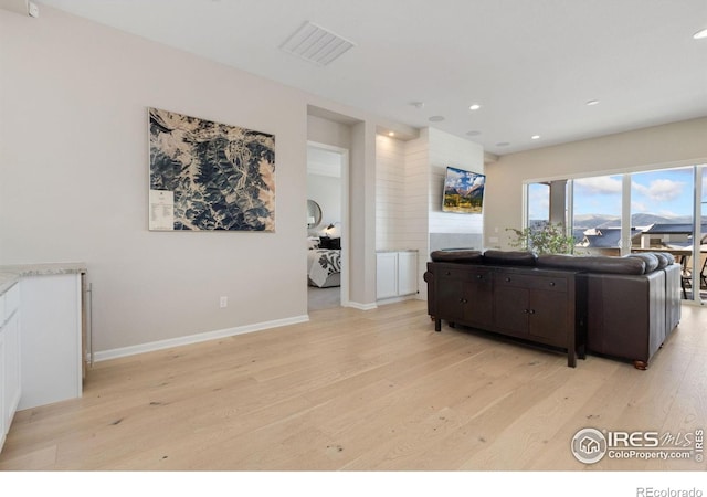 3351 Heron Lakes Pkwy, Berthoud, CO 80513 - living room with baseboards, visible vents, light wood finished floors, and recessed lighting