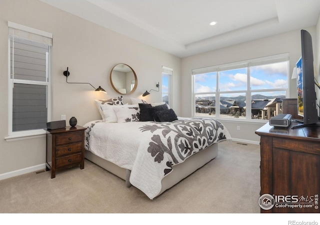 3351 Heron Lakes Pkwy, Berthoud, CO 80513 - bedroom featuring a raised ceiling, light carpet, recessed lighting, and baseboards