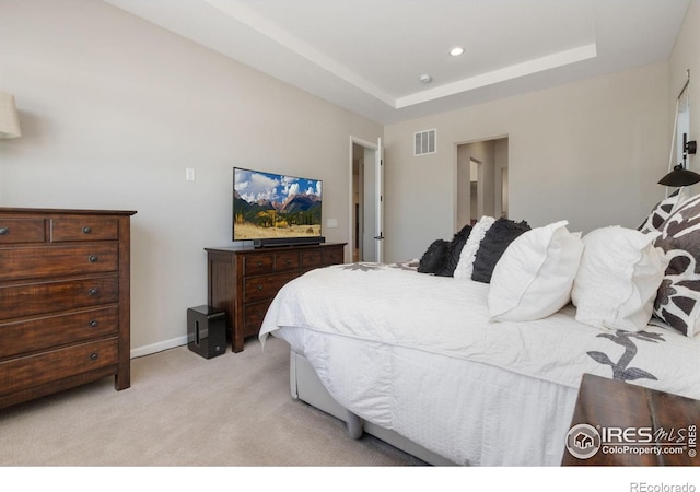 3351 Heron Lakes Pkwy, Berthoud, CO 80513 - bedroom featuring recessed lighting, a tray ceiling, visible vents, light carpet, and baseboards