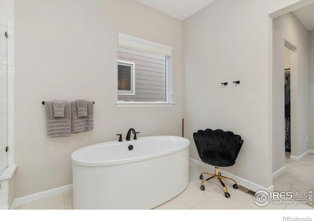3351 Heron Lakes Pkwy, Berthoud, CO 80513 - bathroom with a freestanding bath and baseboards