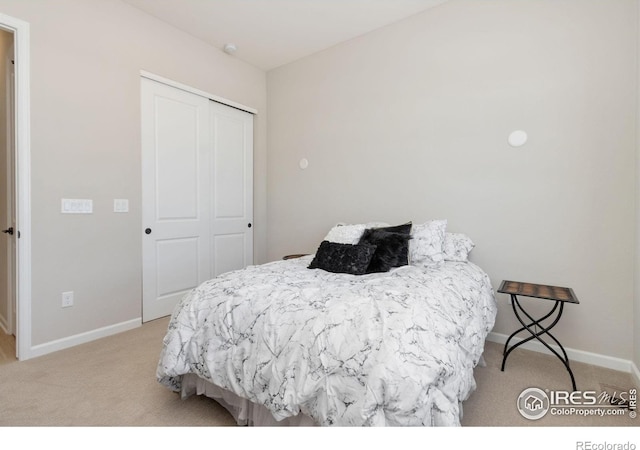 3351 Heron Lakes Pkwy, Berthoud, CO 80513 - bedroom with baseboards, light carpet, and a closet