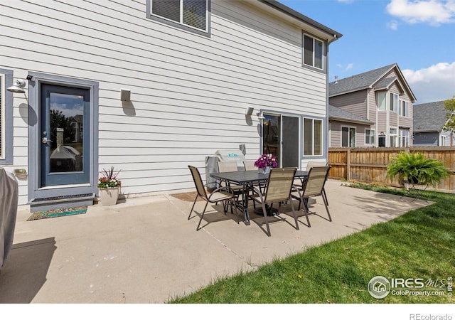 view of patio / terrace featuring outdoor dining area and fence