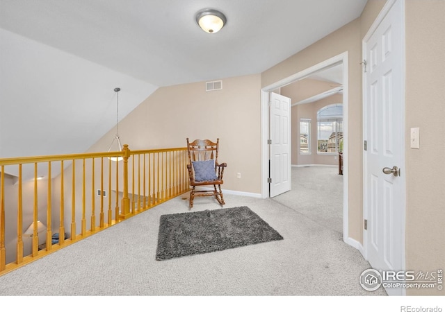 living area with baseboards, carpet, lofted ceiling, and visible vents