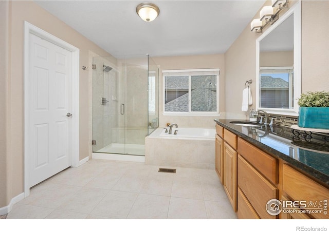 bathroom with vanity, tile patterned floors, visible vents, a garden tub, and a stall shower