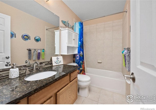 full bathroom with vanity, tile patterned flooring, toilet, and shower / tub combo