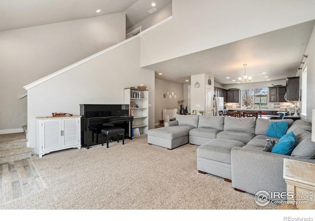 1030 Grand Ave, Windsor, CO 80550 - living room with baseboards, an inviting chandelier, stairs, and recessed lighting